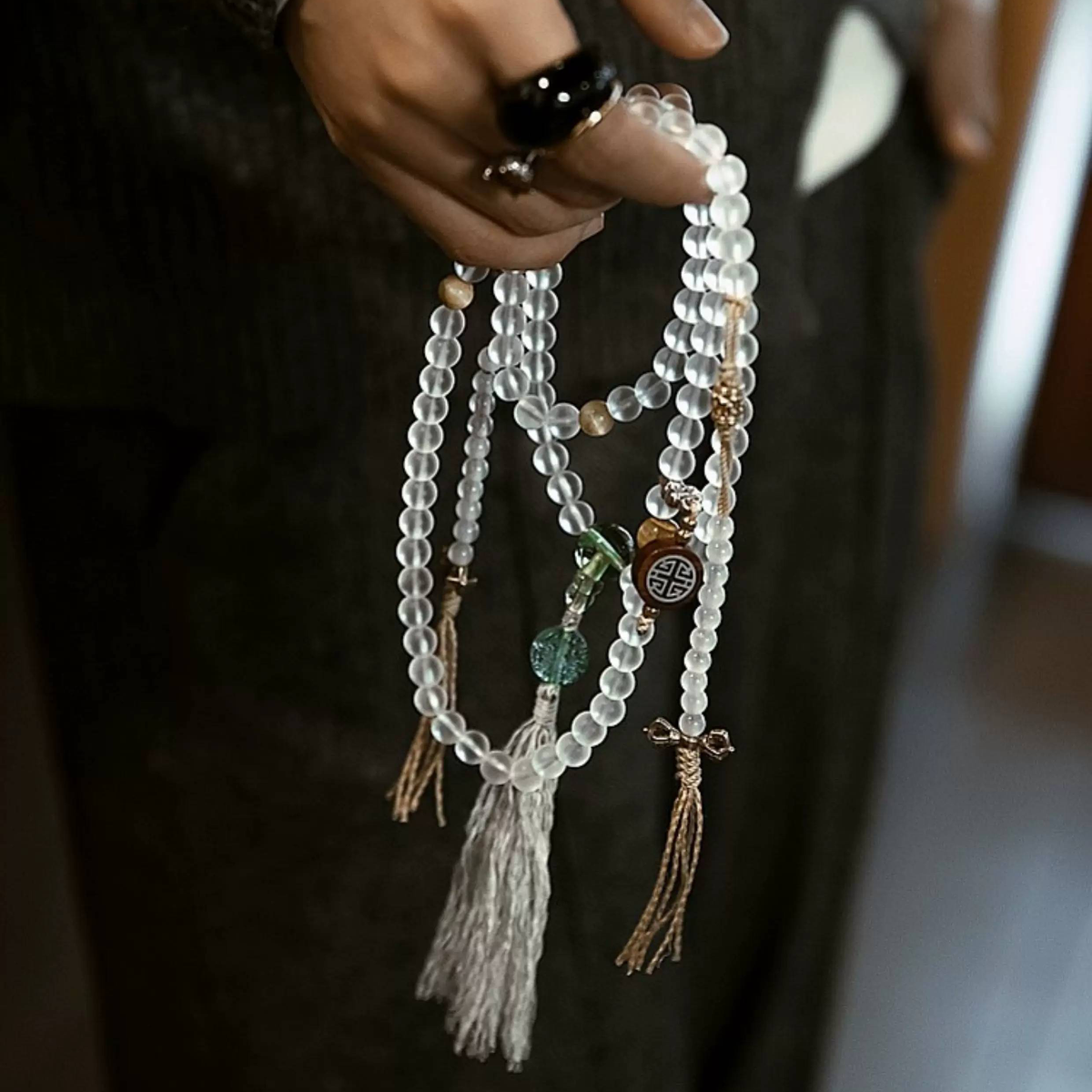 Handmade white glass bead necklace with 108 beads, suitable for meditation and spiritual practice. Women's bracelet featuring White Tara.