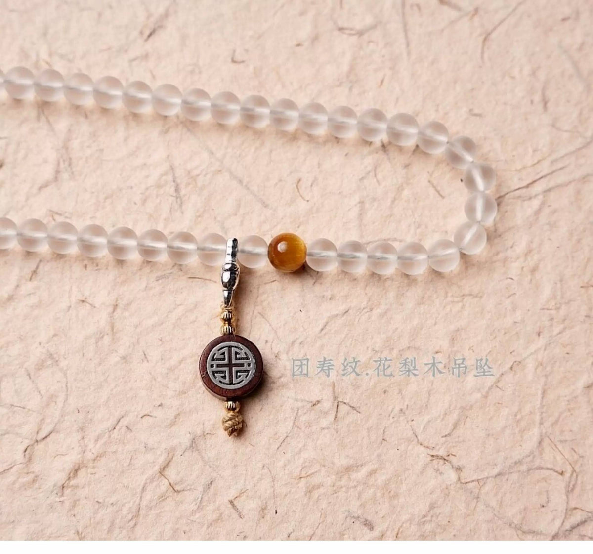 Handmade white glass bead necklace with 108 beads, suitable for meditation and spiritual practice. Women's bracelet featuring White Tara.