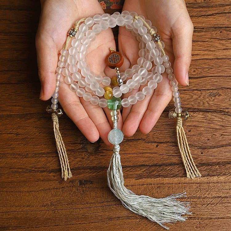 Handmade white glass bead necklace with 108 beads, suitable for meditation and spiritual practice. Women's bracelet featuring White Tara.