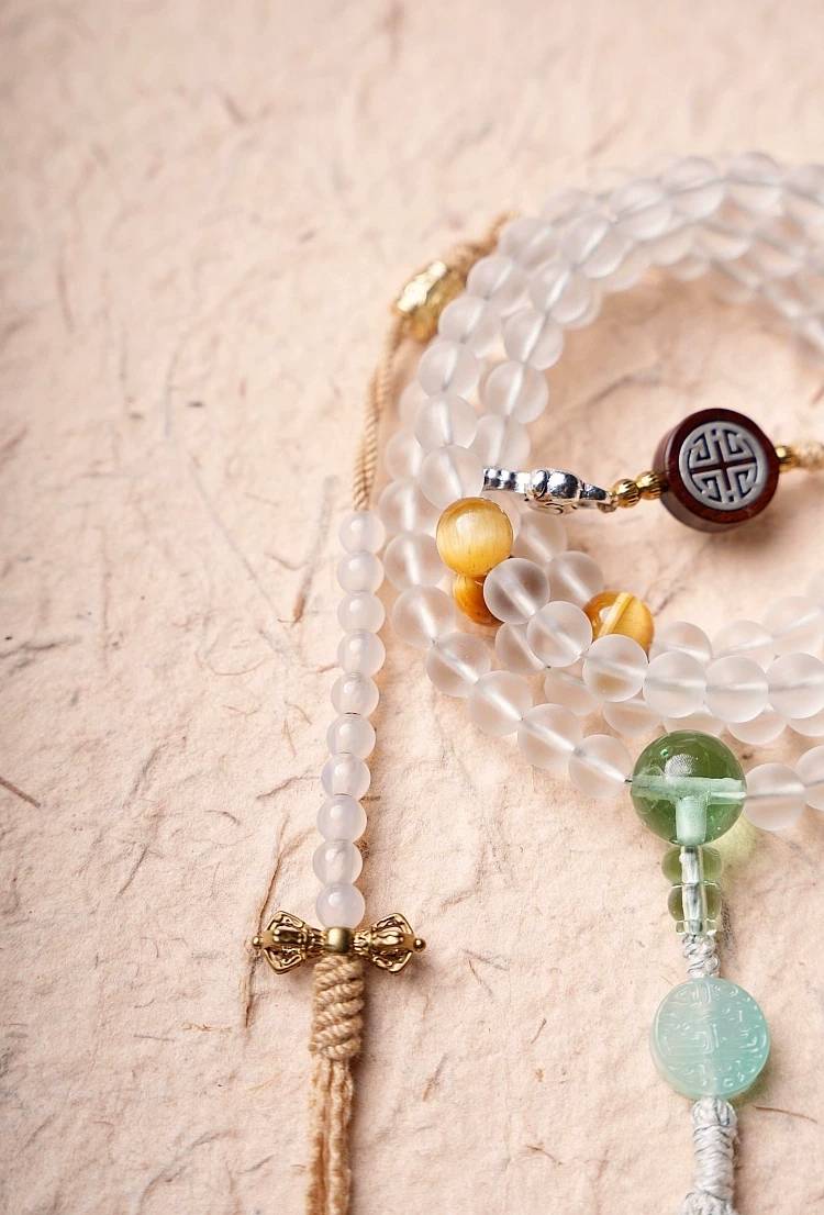 Handmade white glass bead necklace with 108 beads, suitable for meditation and spiritual practice. Women's bracelet featuring White Tara.